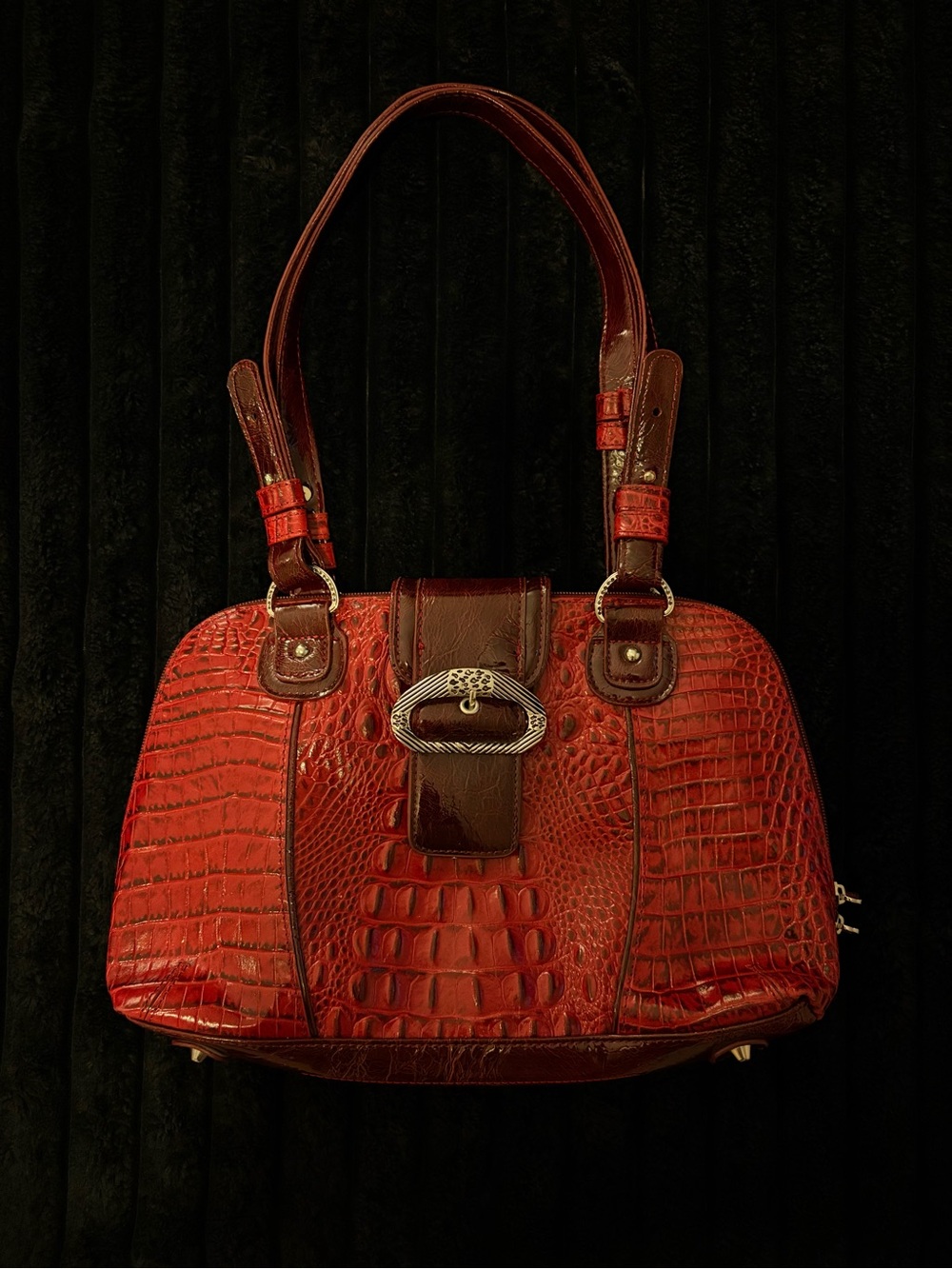 red crocodile textured leather handbag with silver hardware
